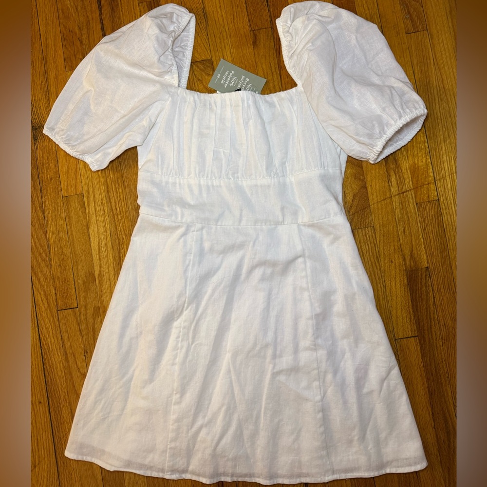 Puff Sleeve White Dress with smocked back and a side zipper NWT size M